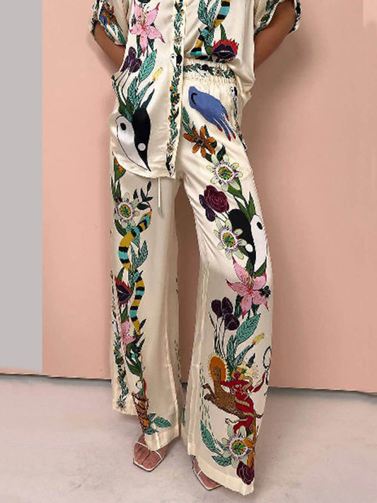 Satin-Hose mit einzigartigem Print, elastischem Bund und Taschen, weitem Bein